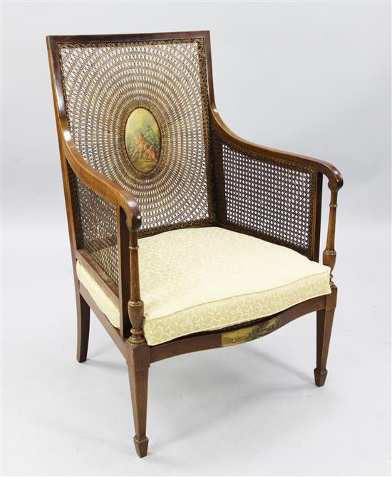 An Edwardian painted mahogany bergere armchair, H.3ft 4in.